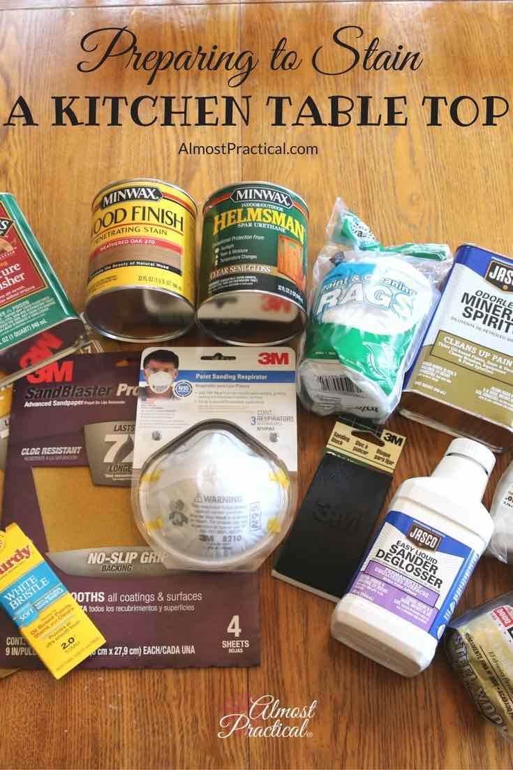 collection of supplies needed for staining a kitchen table top