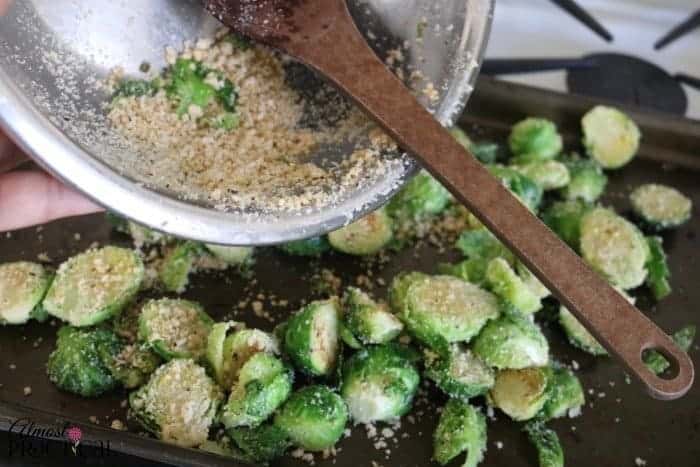 Return the parmesan covered brussels sprouts to the baking sheet.
