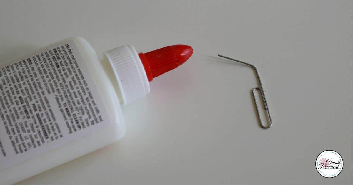 Paperclip hacks - Use paperclips to clean glue caps.