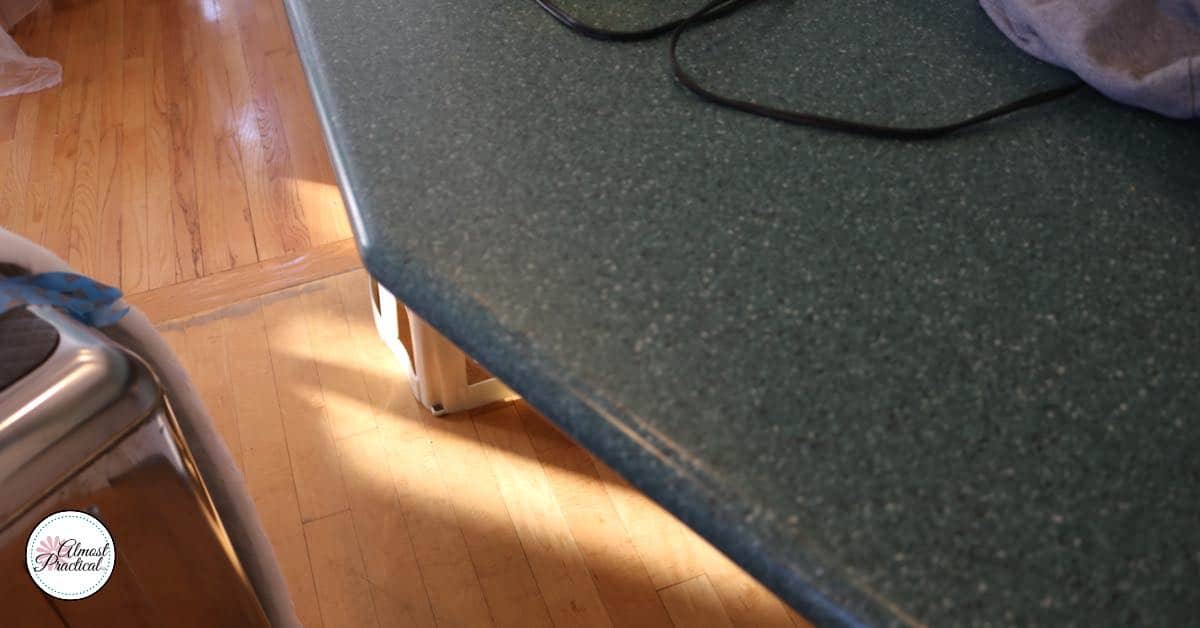 My current solid surface kitchen counter. It is a speckled dark green color and made by DuPont Corian.