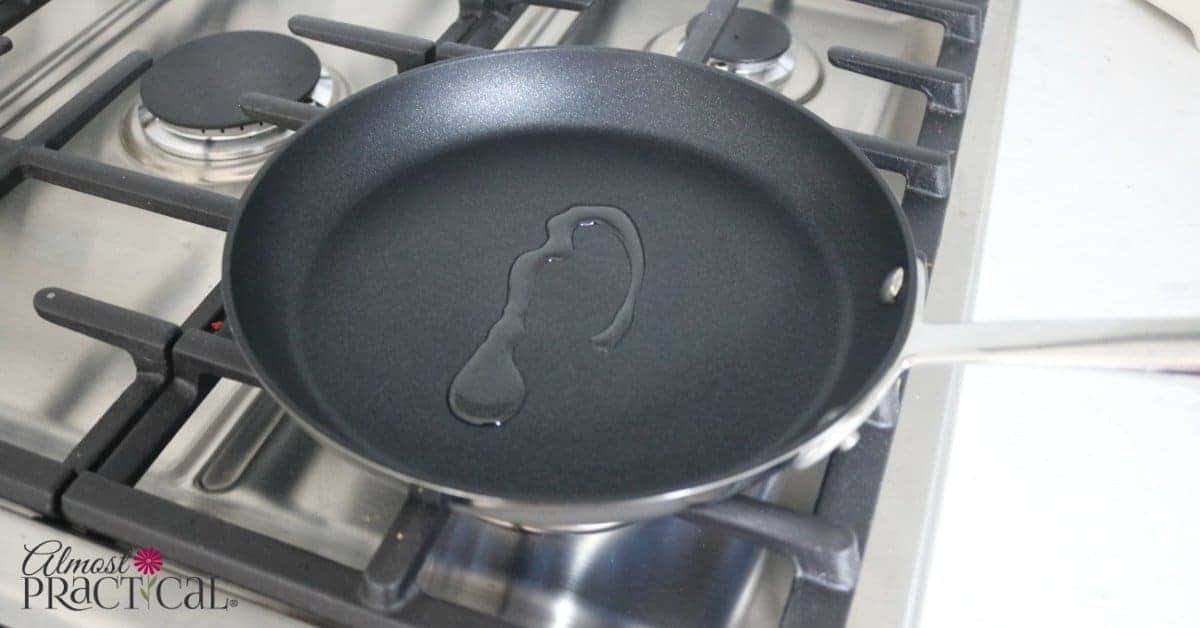 A drizzle of canola oil in a nonstick omelet pan.
