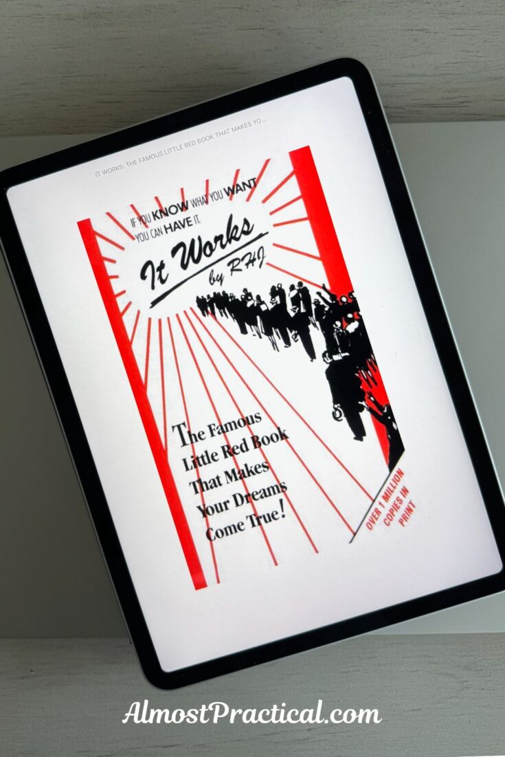 photo of an iPad on a gray table showing the cover image of the book It Works by RHJ