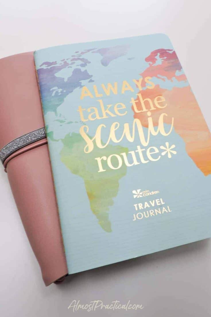 The Erin Condren Travel Journal on to p of the Erin Condren Petite Planner Folio in Mauve.