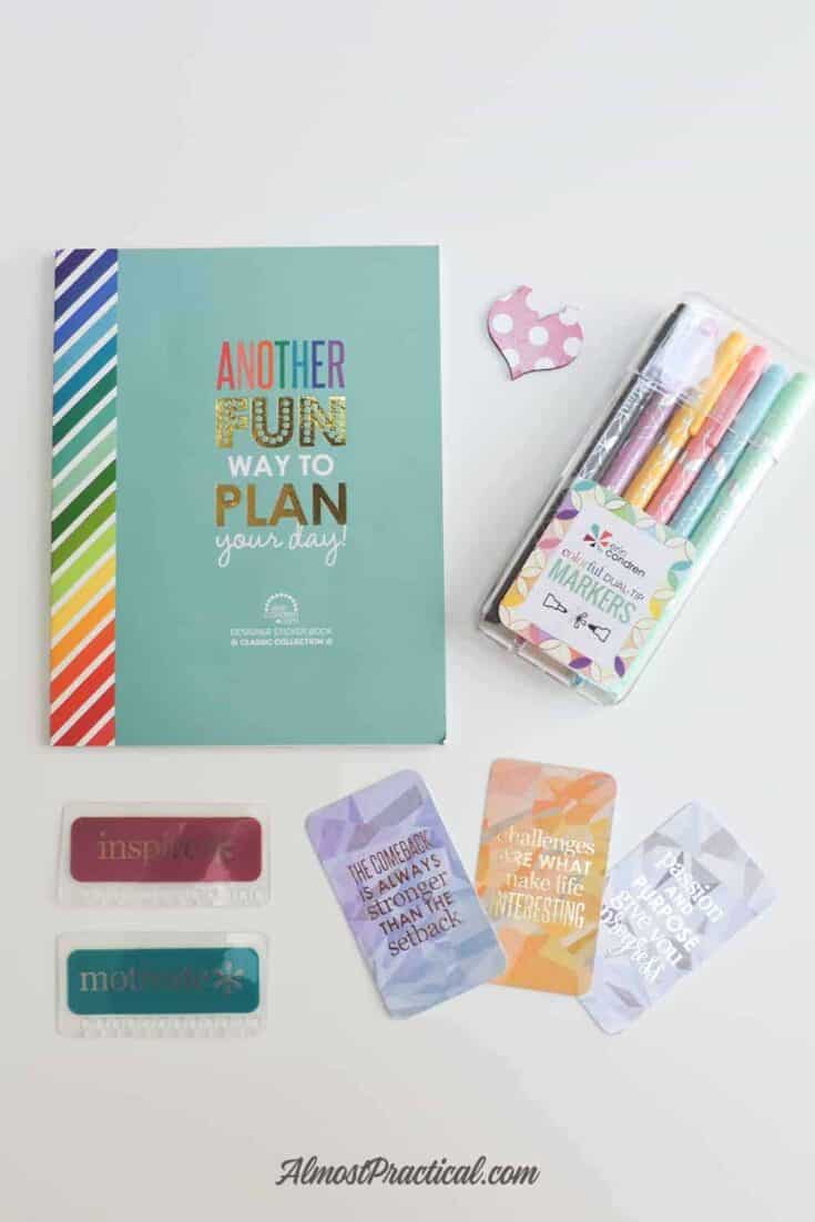 Planner sticker book, magnetic bookmark in heart shape, Erin Condren dual tip markers, snap in bookmarks, and compliment cards.