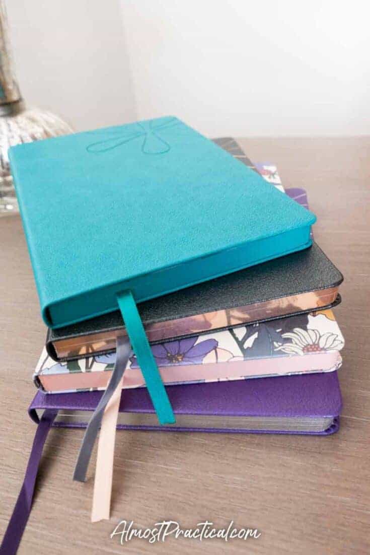 Stack of Erin Condren softbound notebooks.