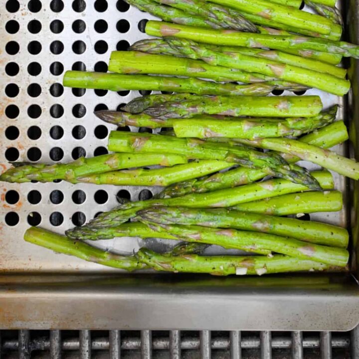 asparagus in grill topper grilling pan on grill
