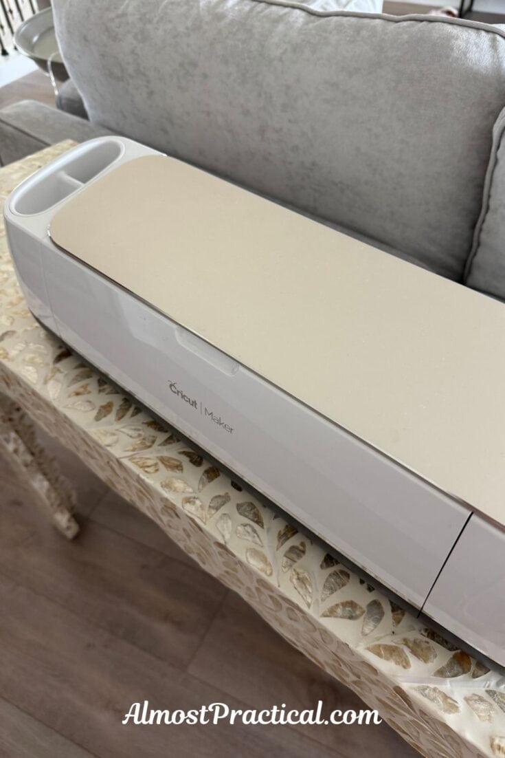 photo of an original cricut maker machine in champagne color on top of a table with inlaid mother of pearl