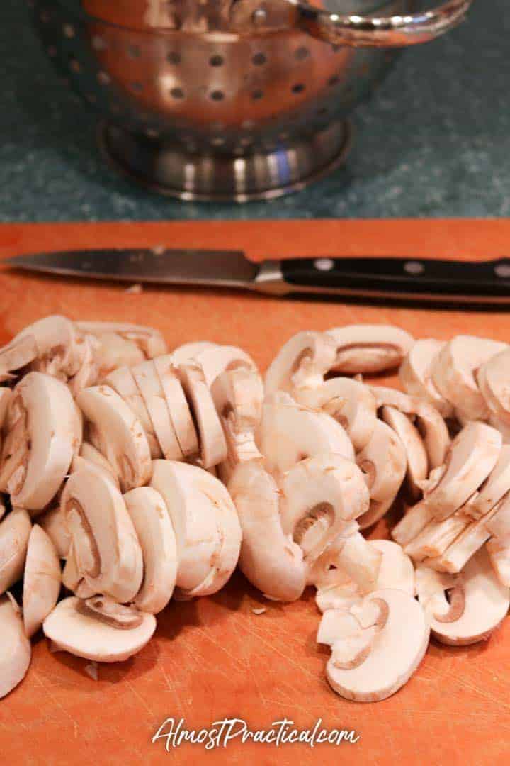 sliced mushrooms on a cutting board