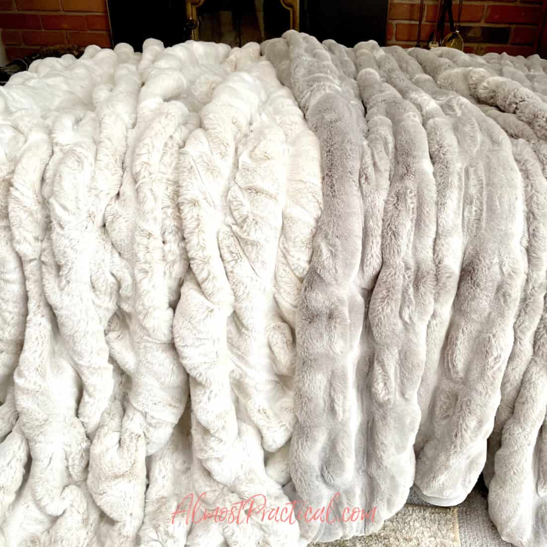 2 pottery barn faux fur ruched throws side by side