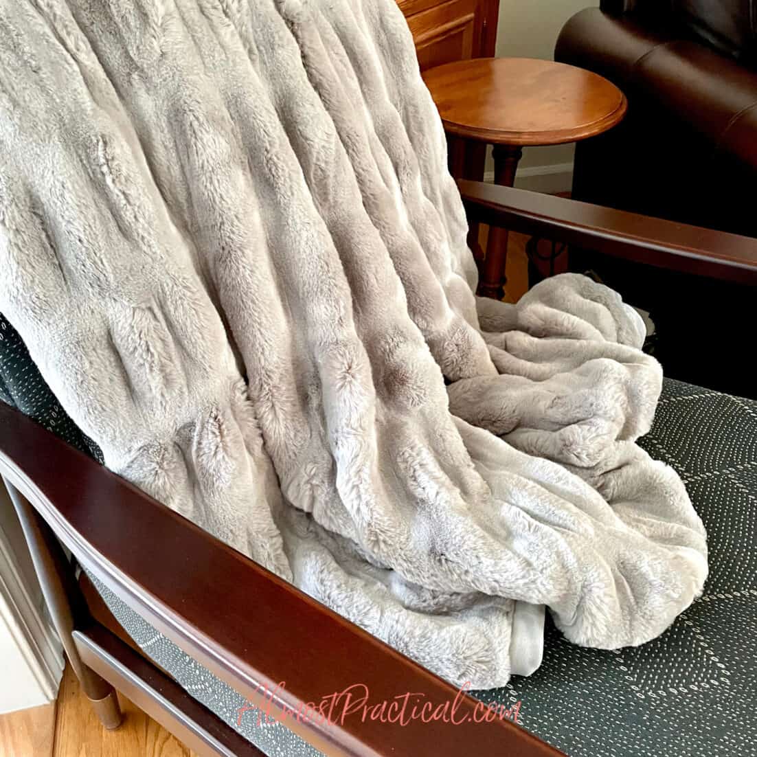 the small pottery barn faux fur ruched throw in gray