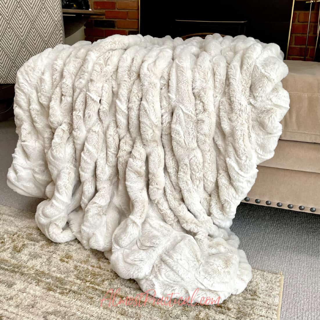 the large pottery barn faux fur ruched throw in ivory