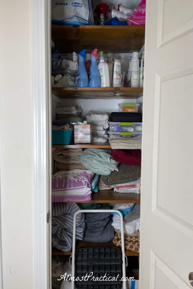 messy small linen closet