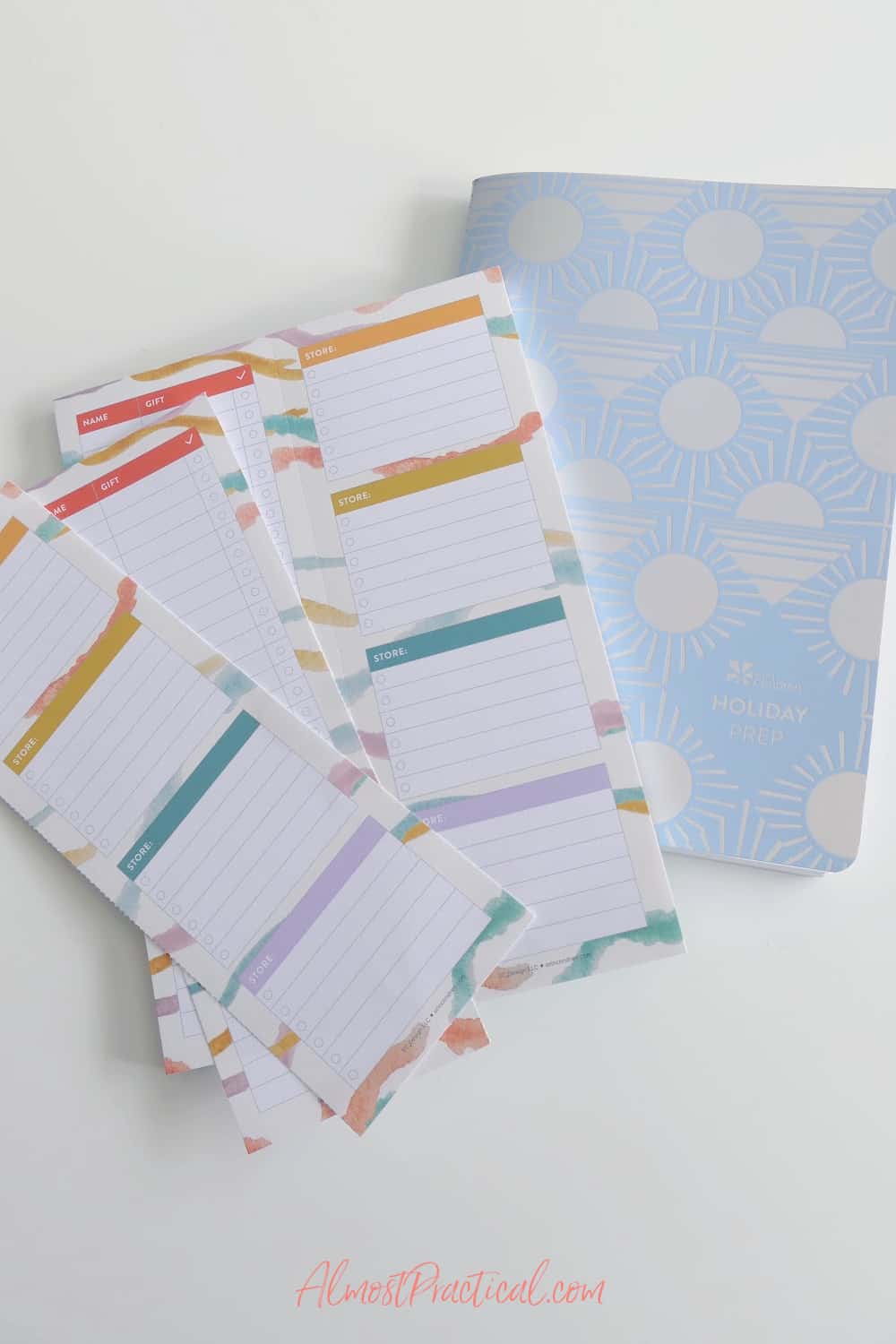 A notepad for a holiday gift list and a planning notebook.