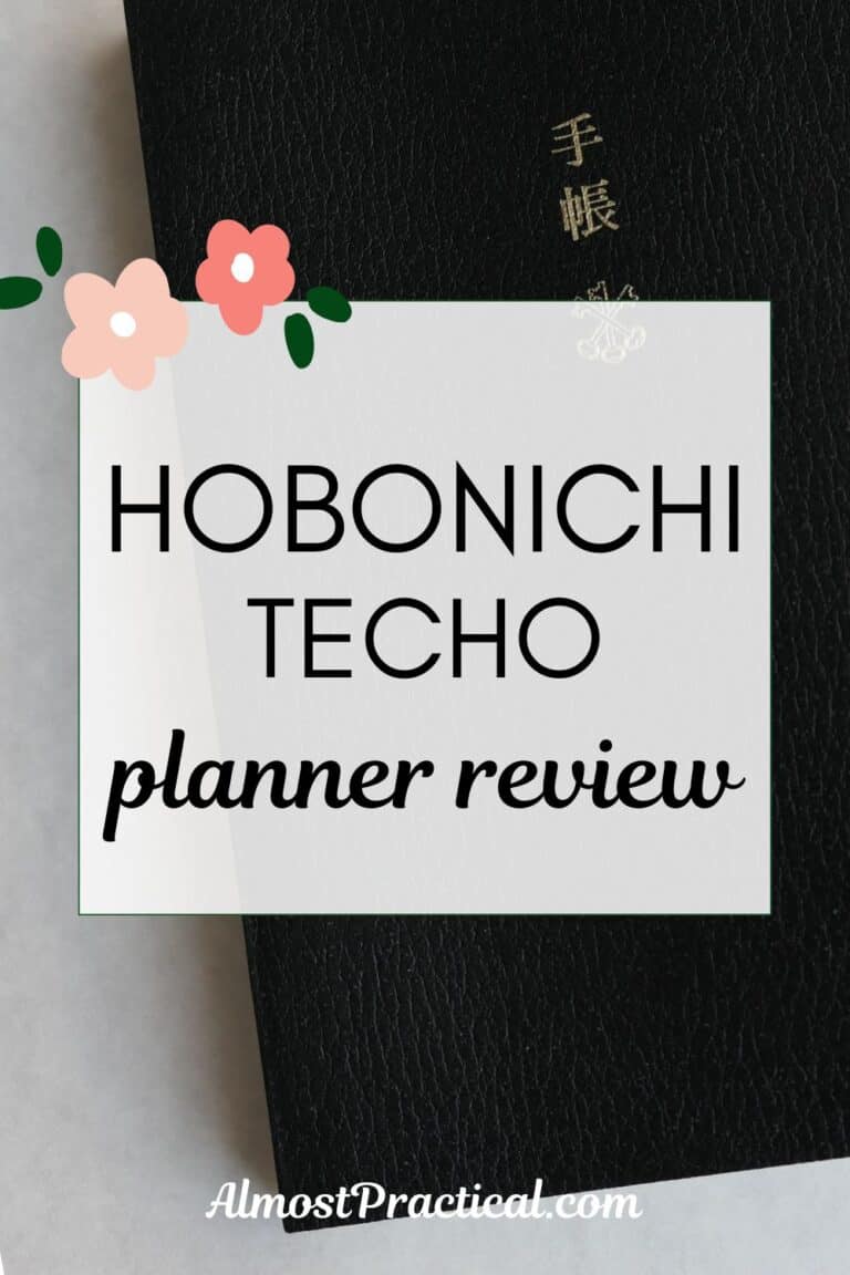 words "hobonichi techo planner review" superimposed on a photo of the actual planner which has a black cover set on a white table