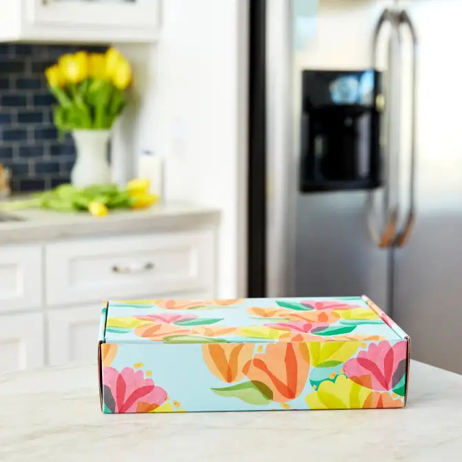 floral cardboard shipping box on kitchen counter
