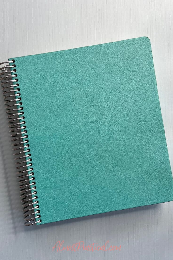 teal colored coiled notebook