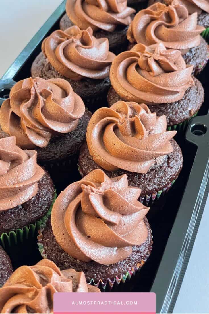 tray of chocolate cupcakes with chocolate frosting