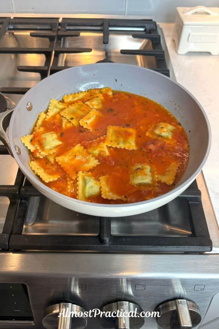 ravioli and tomato sauce in a skillet
