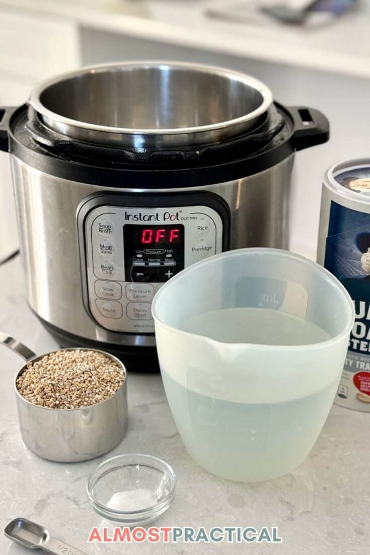 instant pot in background with a cup of uncooked steel cut oats, a measuring cup of water, and a tiny bowl of salt