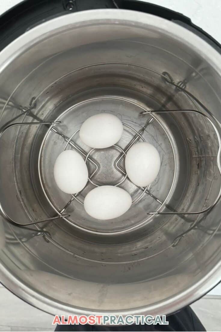 four eggs on trivet in Instant Pot