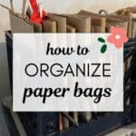 words "how to organize paper bags" superimposed on a photo of paper bags neatly folded in a dark color milk crate