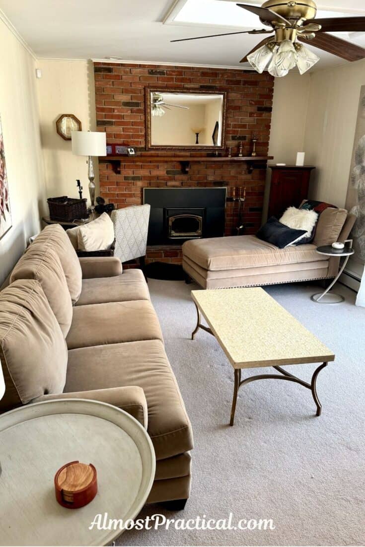 photo of living room with sofa on one side and chaise lounge on the other