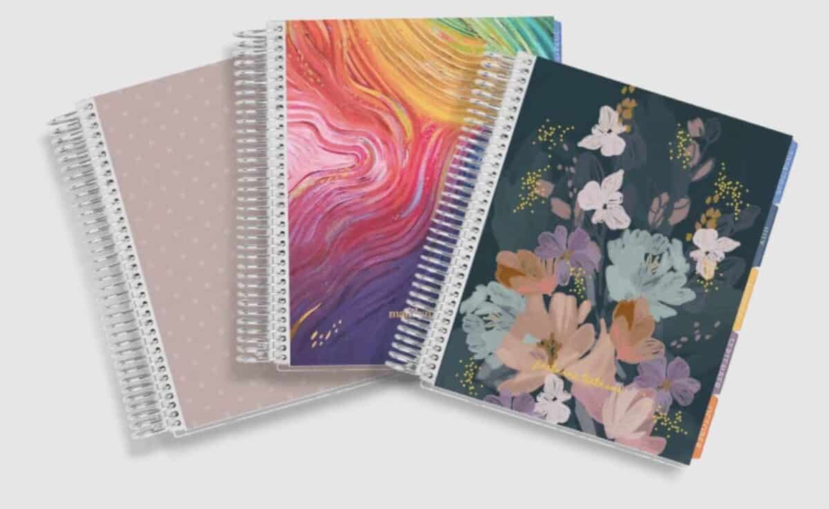 photo of three coiled planners with different covers.