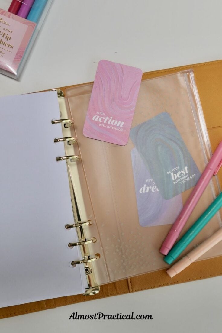 ring agenda style planner open to last page which is a vinyl pencil pouch that is bindered in