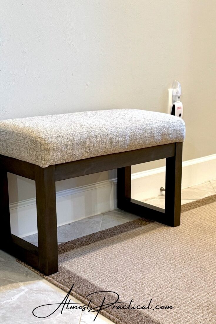 a small bench in a foyer