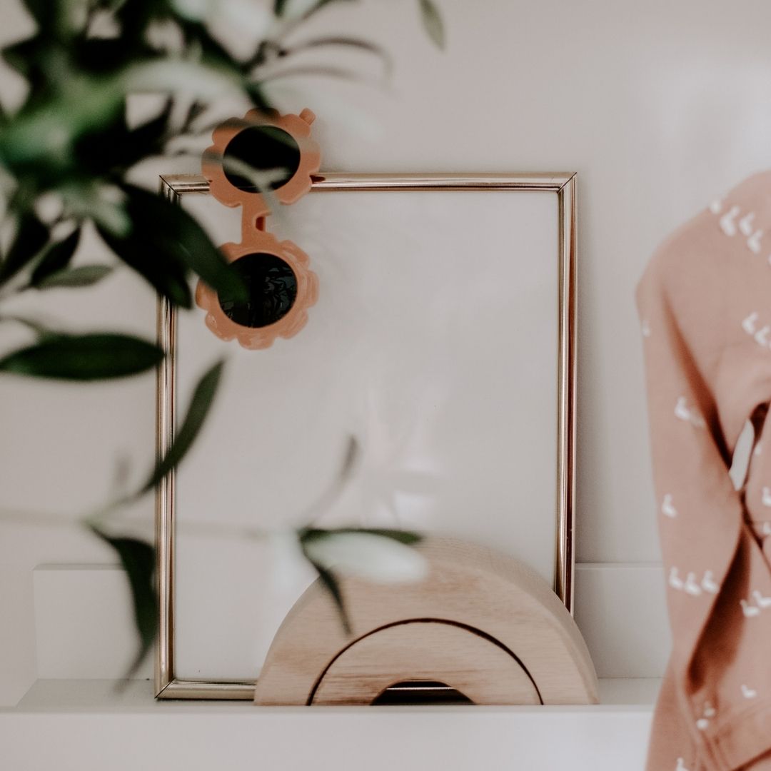 photo of a picture frame and plant