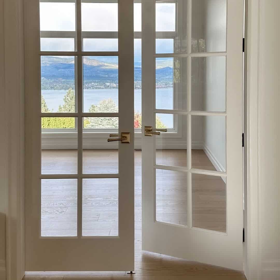 photo of french doors overlooking a lake