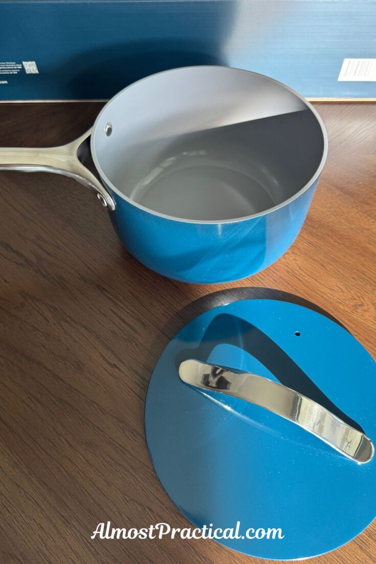 a photo of the caraway 3 quart ceramic coated saucepan with lid in navy color
