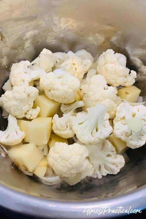 raw cauliflower, onions, and potatoes