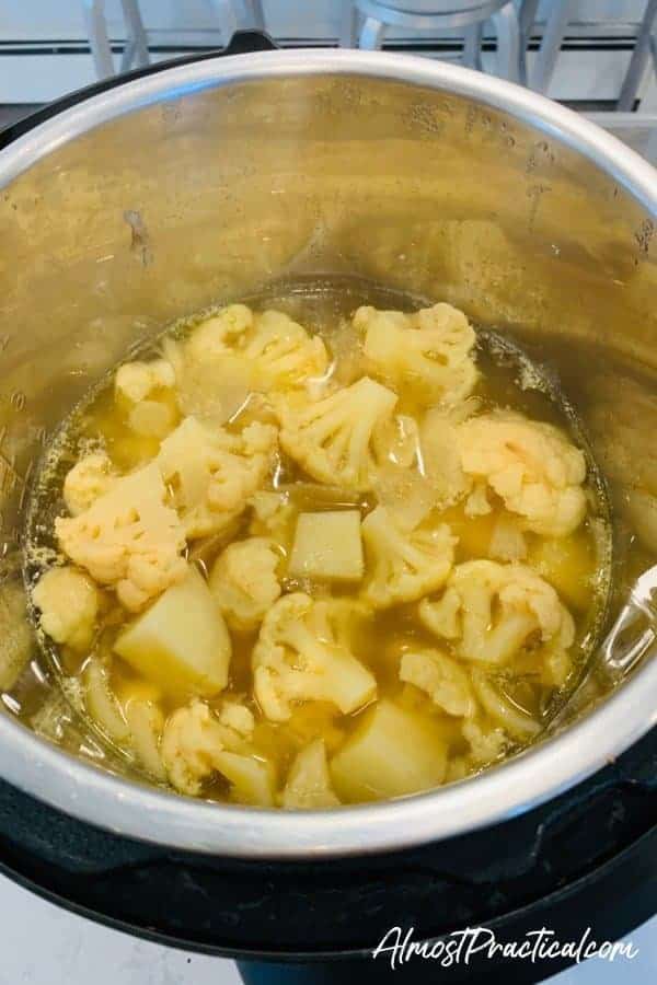 cooked cauliflower, potatoes, and onions in the Instant Pot