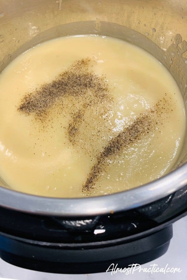 seasoning the cauliflower soup in the Instant Pot